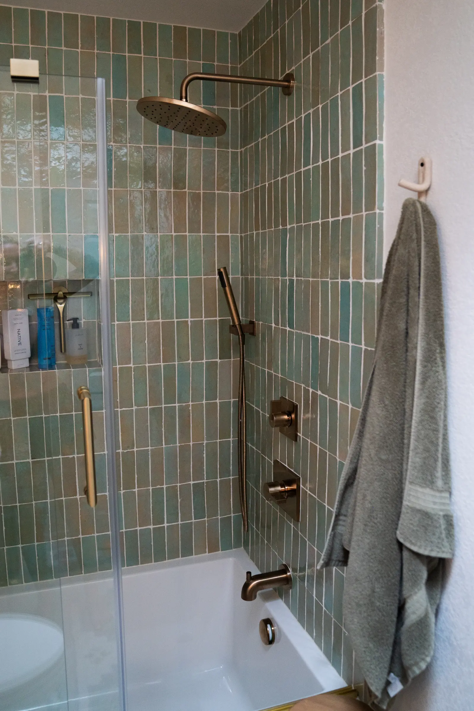 Layered handmade tile surface in an East Boulder bathroom