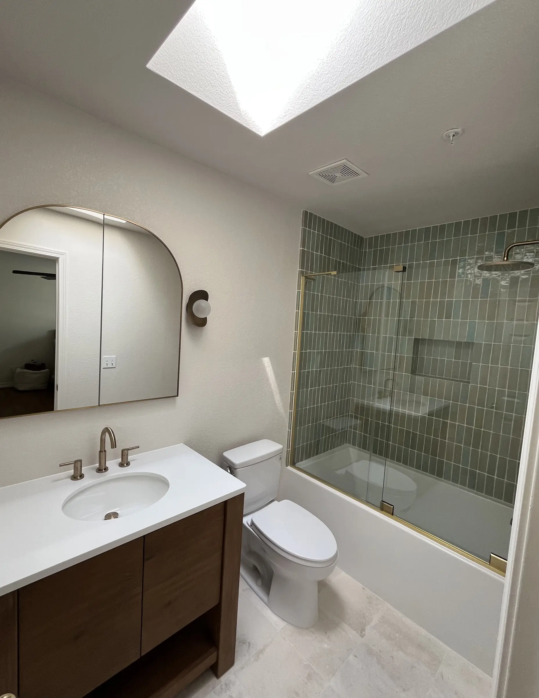 Green shower bathroom detail with handmade tile