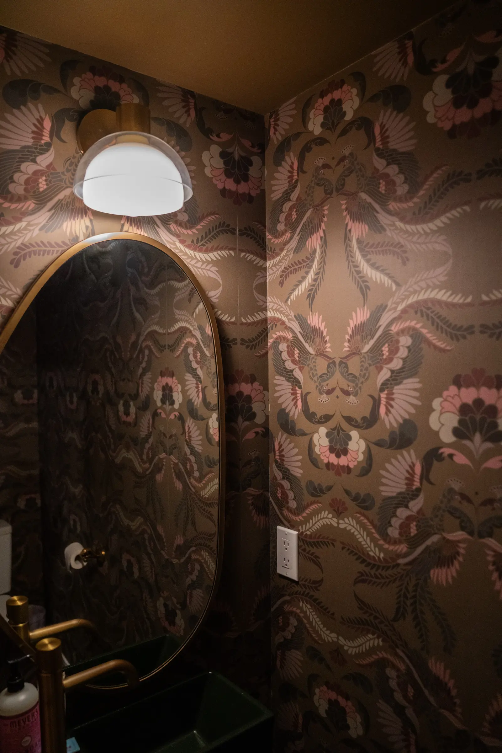 East Boulder powder room with wallpaper and small green sink