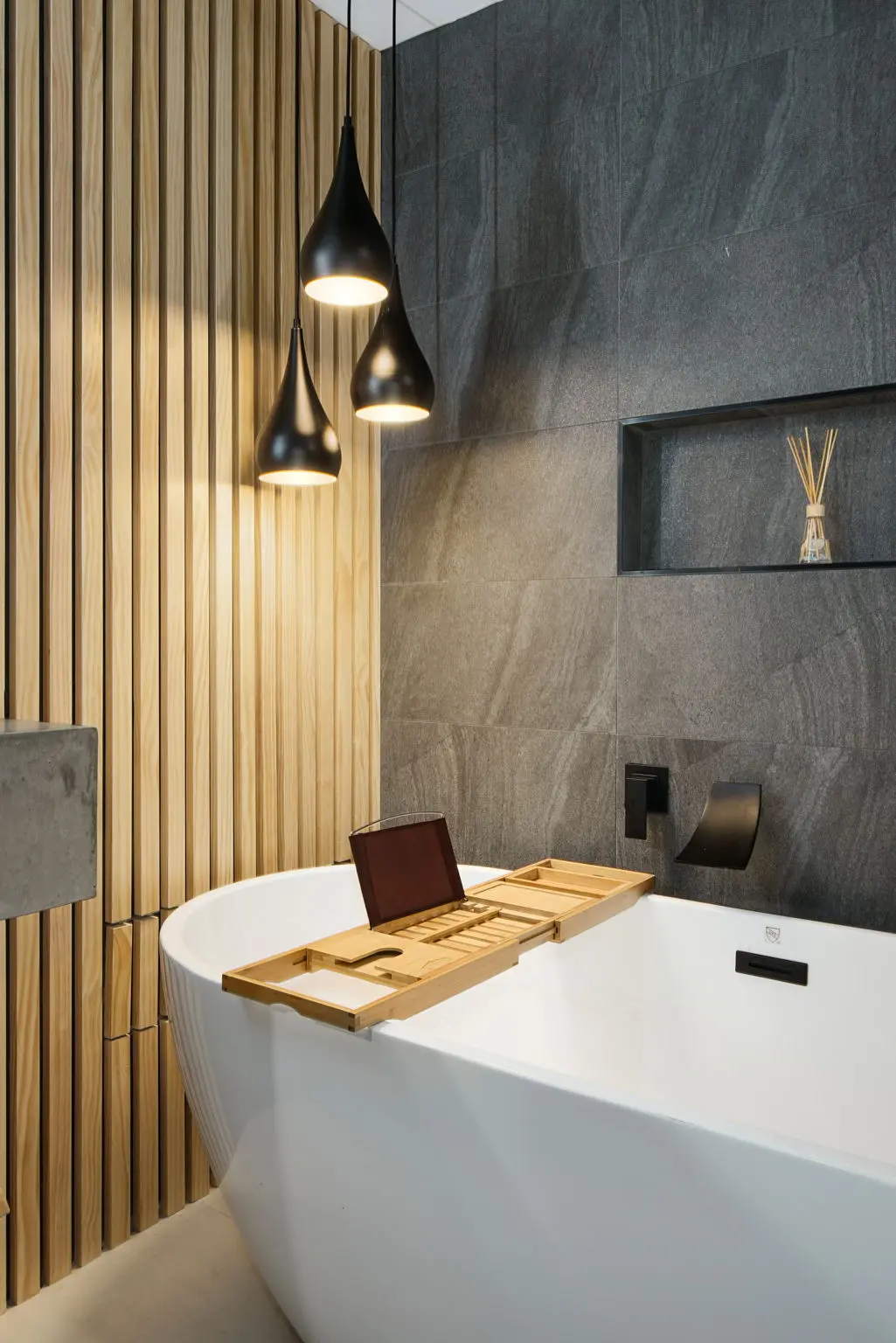 Custom concrete sink with built-in shelf in a South Boulder spa bathroom remodel